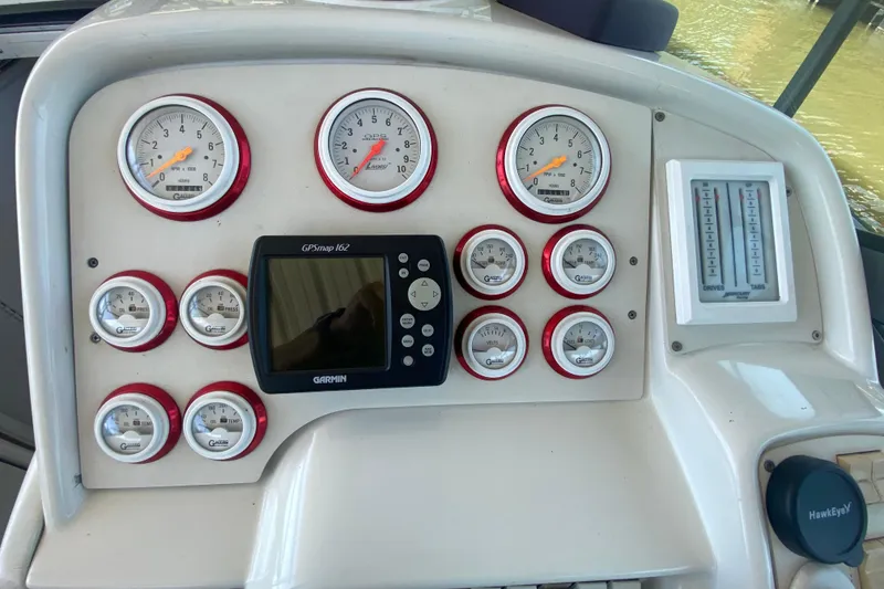 Slide: The Image of Dashboard of a 2002 Formula 382 FASTech boat with gauges and Garmin GPS. - 23
