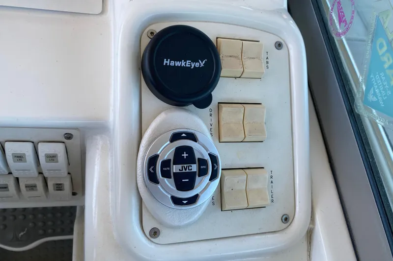 Slide: The Image of Control panel of a 2002 Formula 382 FASTech boat with JVC audio controls. - 24