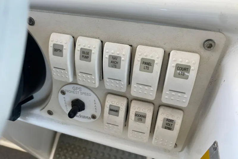 Slide: The Image of Control panel of a 2002 Formula 382 FASTech boat with labeled switches. - 26