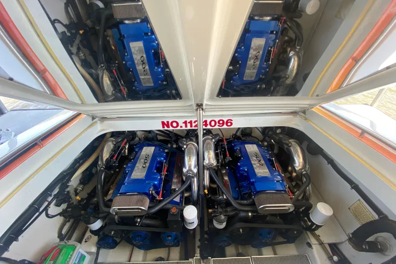 Slide: The Image of Engine compartment of a 2002 Formula 382 FASTech boat, featuring dual blue engines. - 29