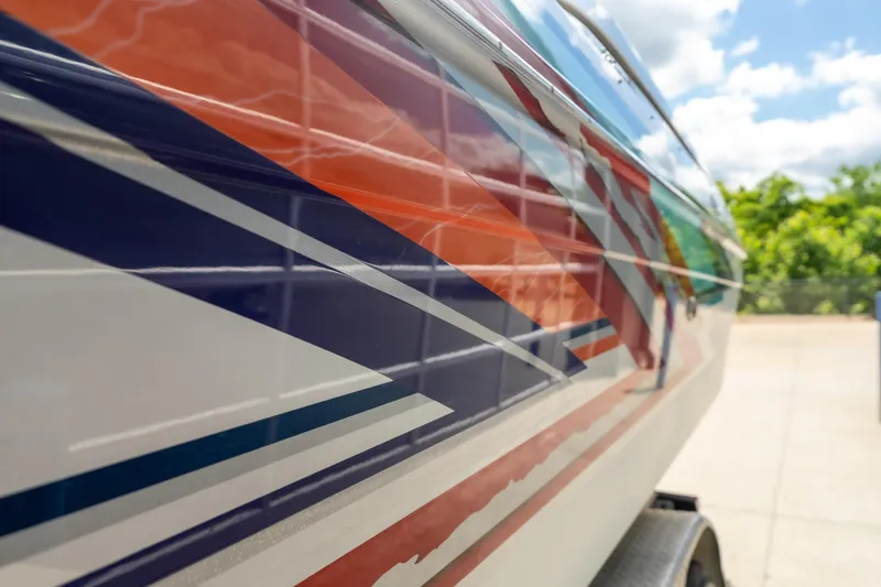 Slide: The Image of Close-up of 2002 Formula 382 FASTech boat with vibrant geometric graphics. - 3