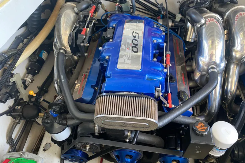 Slide: The Image of 2002 Formula 382 FASTech engine with blue accents and performance components. - 30