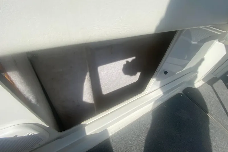 Slide: The Image of Interior view of a 2002 Formula 382 FASTech boat, showing storage compartment. - 33