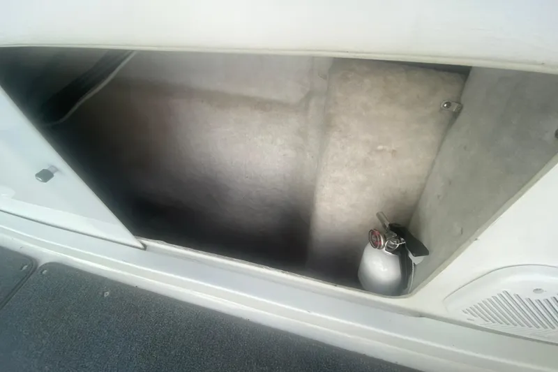 Slide: The Image of Storage compartment with fire extinguisher in 2002 Formula 382 FASTech boat. - 34