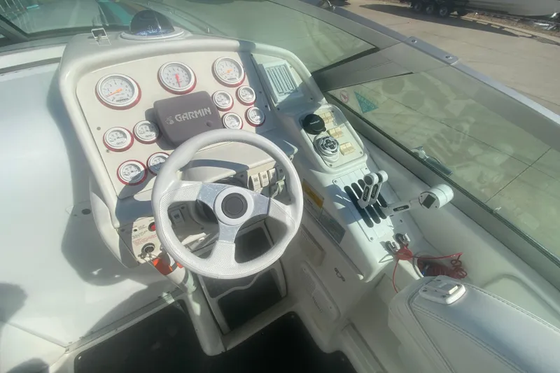 Slide: The Image of Cockpit of 2002 Formula 382 FASTech boat with steering wheel and control panel. - 38