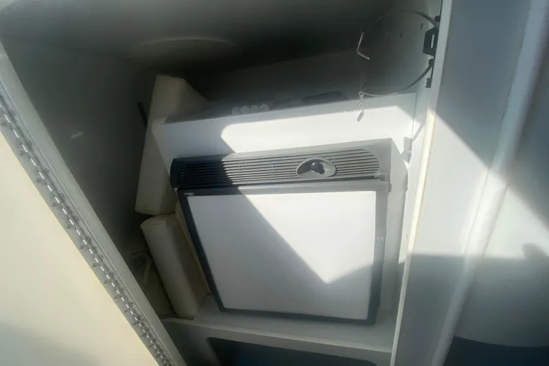 Slide: The Image of 2002 Formula 382 FASTech interior storage with compact refrigerator. - 39