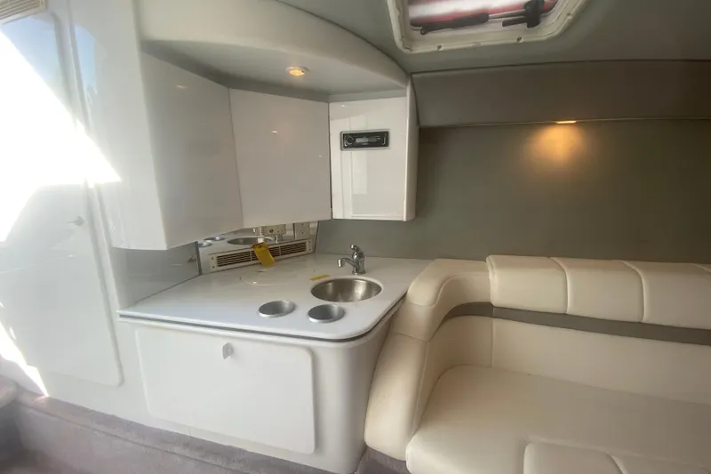 Slide: The Image of Interior of 2002 Formula 382 FASTech boat with kitchenette and seating area. - 43