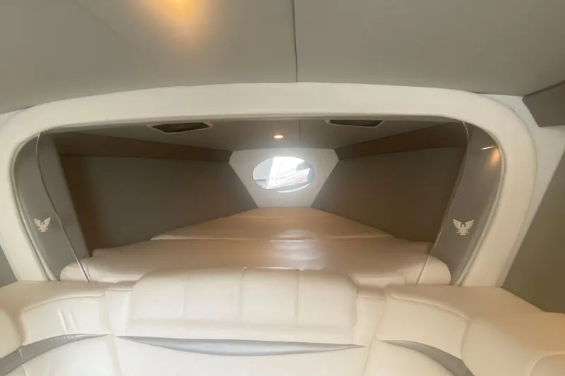 Slide: The Image of Interior cabin of a 2002 Formula 382 FASTech boat, featuring plush seating and modern design. - 44