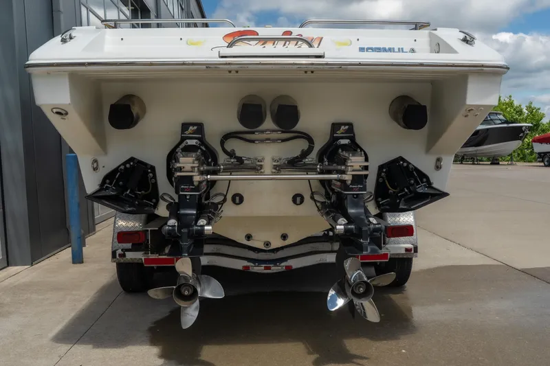 Slide: The Image of Rear view of a 2002 Formula 382 FASTech boat with dual propellers. - 5