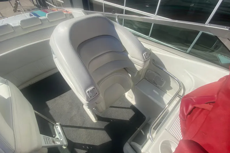 Slide: The Image of Interior of a 2002 Formula 382 FASTech boat with white seating and metal railings. - 50