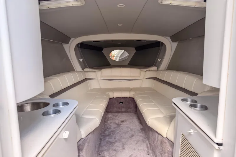 Slide: The Image of Interior of a 2002 Formula 382 FASTech boat with plush seating and modern amenities. - 8