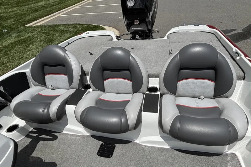 Slide: The Image of 2014 Nitro Z-6 boat interior with three cushioned seats and OptiMax engine. - 10