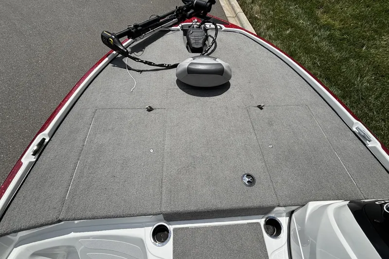 Slide: The Image of 2014 Nitro Z-6 boat deck with trolling motor and carpeted surface. - 11