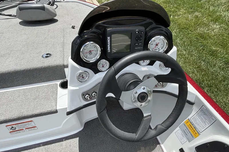Slide: The Image of Steering console of a 2014 Nitro Z-6 boat with gauges and Lowrance display. - 12