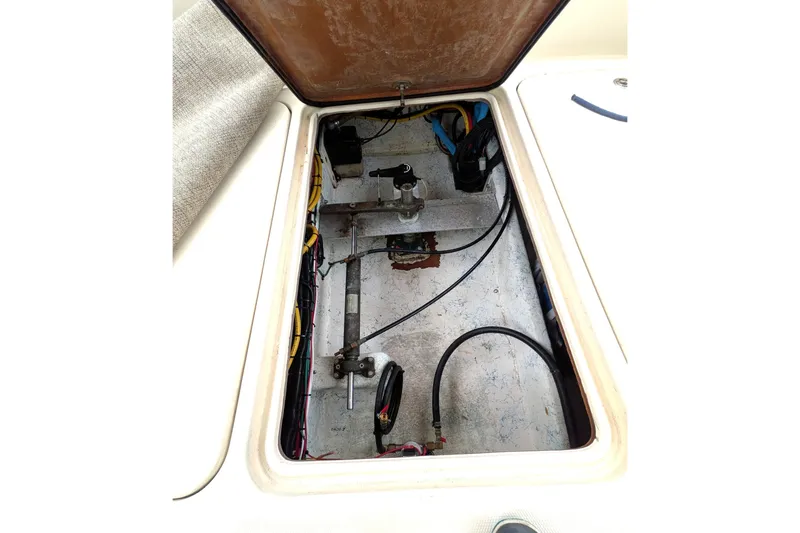 Slide: The Image of Open hatch of 2003 Atlas Acadia 32 boat showing internal wiring and components. - 12