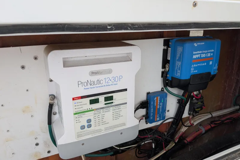 Slide: The Image of Electrical system with ProNautic charger and SmartSolar controller in 2003 Atlas Acadia 32. - 15