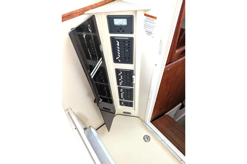Slide: The Image of Electrical panel of 2003 Atlas Acadia 32 boat, featuring switches and controls. - 19