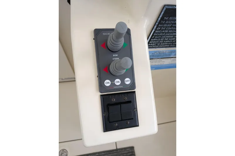 Slide: The Image of Control panel with joysticks on a 2003 Atlas Acadia 32 boat. - 25