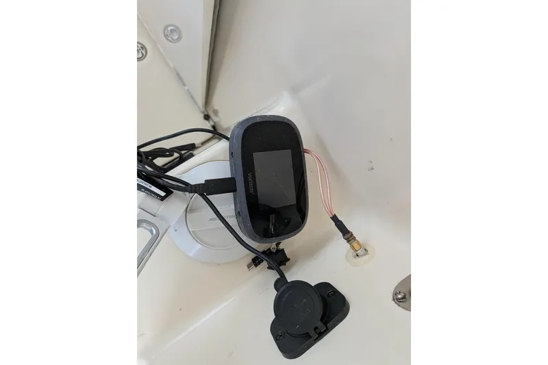 Slide: The Image of Boat electronics setup in a 2003 Atlas Acadia 32, featuring various connected devices. - 26