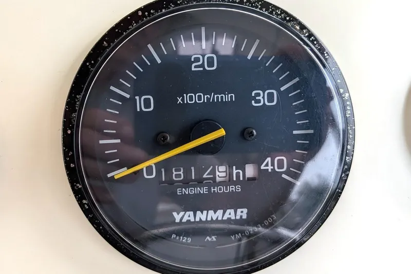 Slide: The Image of Yanmar engine hour meter showing 1812.9 hours on Atlas Acadia 32, 2003 model. - 28