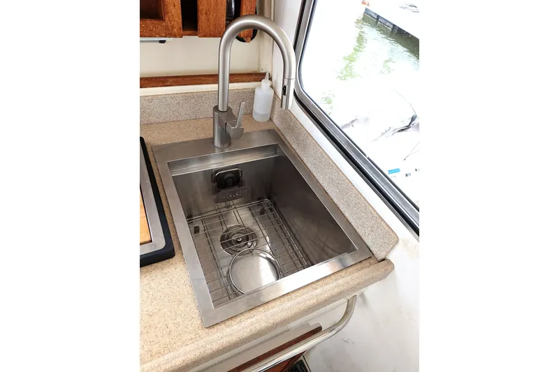 Slide: The Image of Stainless steel sink in 2003 Atlas Acadia 32 boat kitchen. - 31