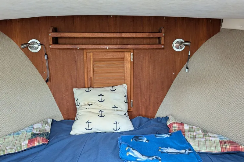 Slide: The Image of Cozy cabin interior of 2003 Atlas Acadia 32 with nautical-themed bedding. - 36