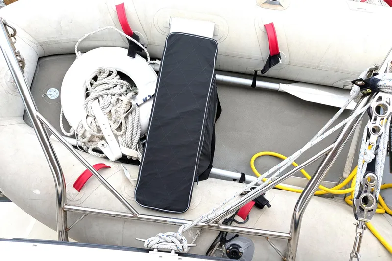Slide: The Image of Inflatable boat with ropes, oar, and safety equipment on Atlas Acadia 32, 2003 model. - 4