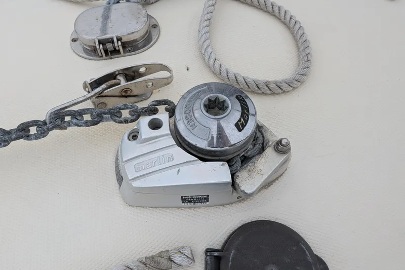 Slide: The Image of Anchor windlass on 2003 Atlas Acadia 32 boat deck with chain and rope. - 42
