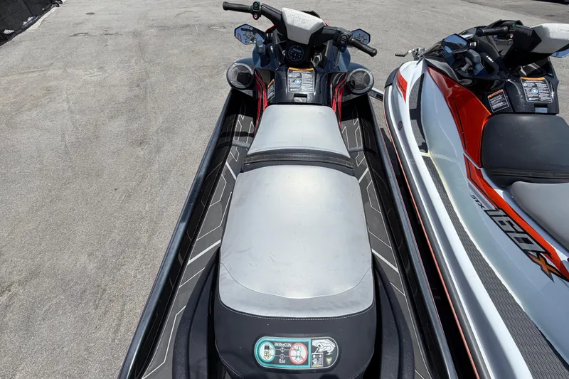 Slide: The Image of Two jet skis are parked side by side on a trailer. - 9