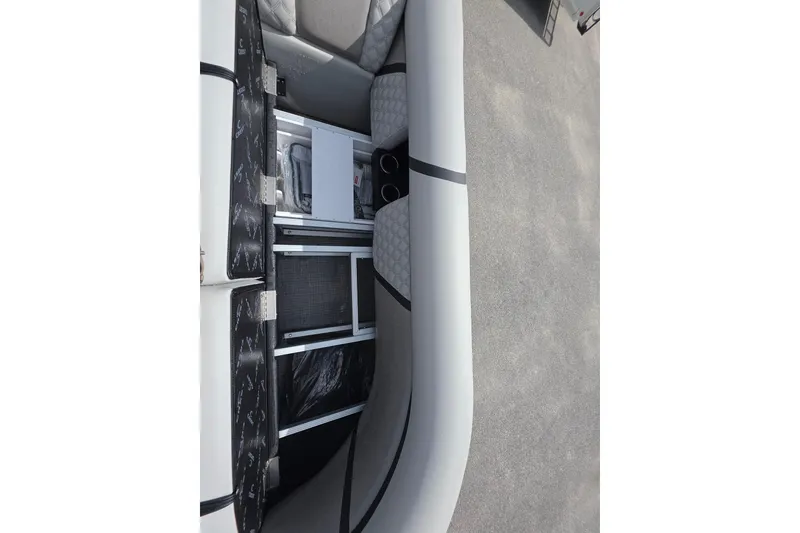 Slide: The Image of Interior view of 2026 Crest Conquest 235 SLC boat, showcasing seating and storage compartments. - 9