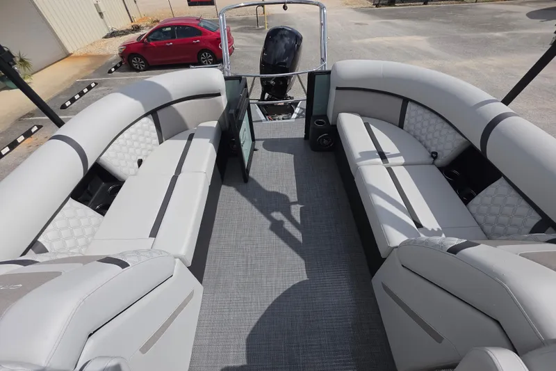 Slide: The Image of 2026 Crest Conquest 235 SLC pontoon boat with spacious seating and modern design. - 11