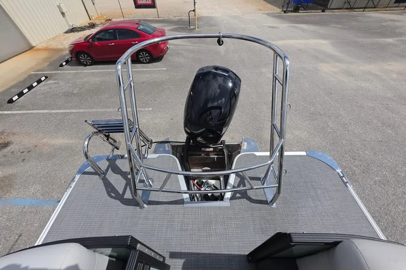 Slide: The Image of 2026 Crest Conquest 235 SLC boat with outboard motor in parking lot. - 14