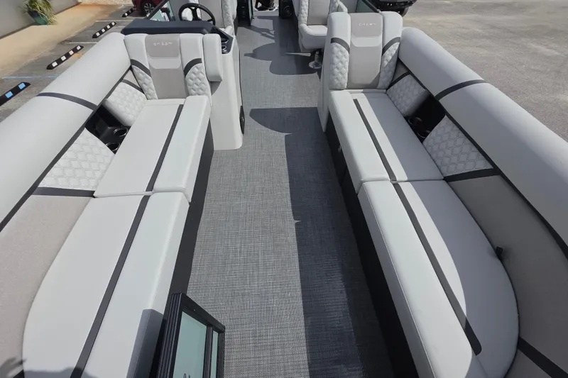 Slide: The Image of 2026 Crest Conquest 235 SLC boat interior with luxurious seating and modern design. - 13