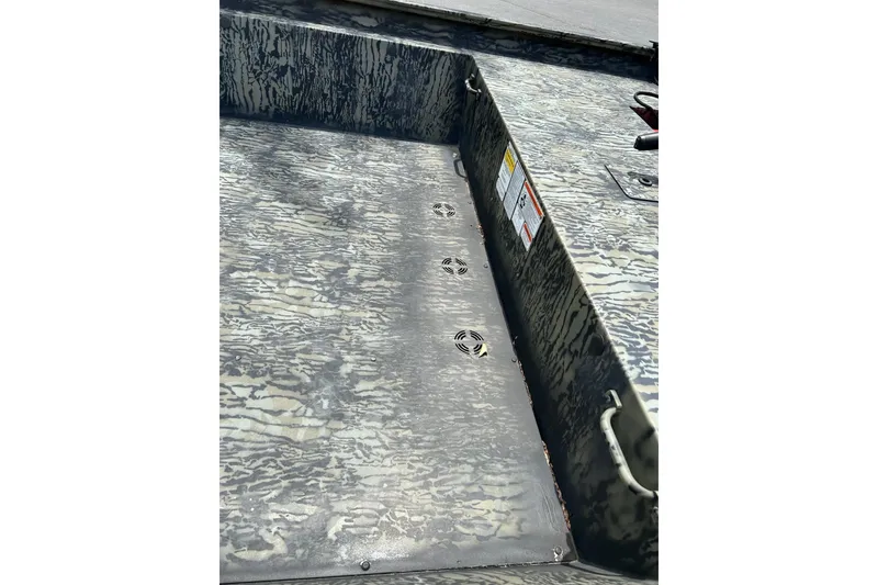 Slide: The Image of Interior view of 2025 Tracker Grizzly 1860 AWL boat with camouflage pattern. - 6
