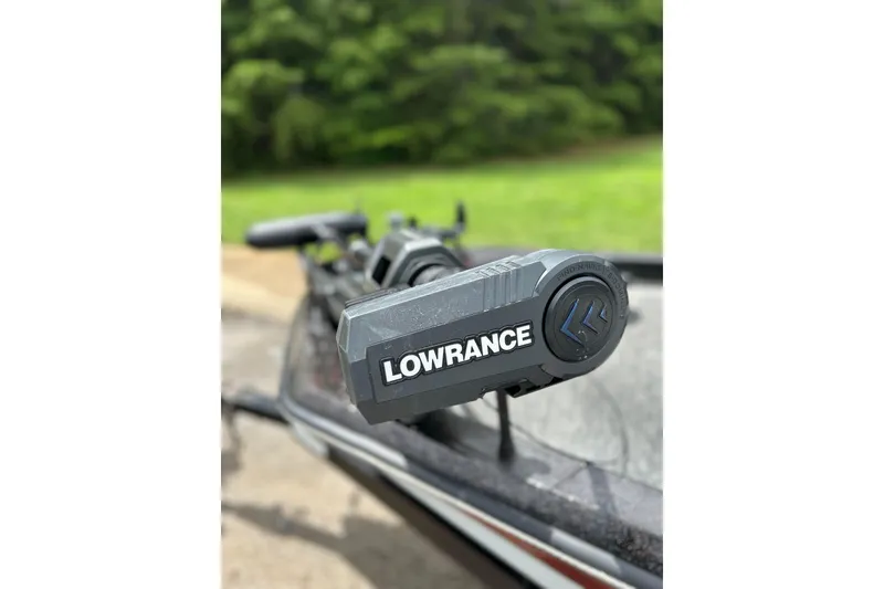 Slide: The Image of Lowrance device on 1988 Aries Bass boat, with blurred green background. - 4