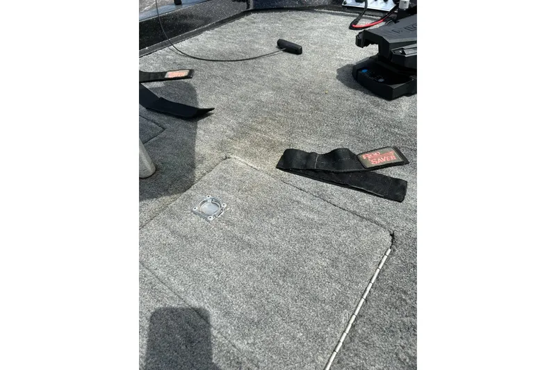 Slide: The Image of Interior of 1988 Aries Bass boat with carpeted flooring and equipment. - 6