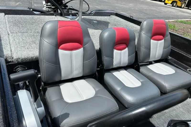 Slide: The Image of 1988 Aries Bass boat seats with red and gray upholstery, showcasing modern design. - 7