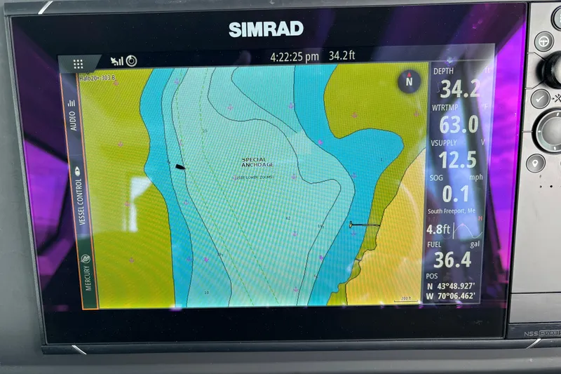 Slide: The Image of Simrad navigation display on 2022 Axopar 28 Cabin, showing depth and location data. - 23