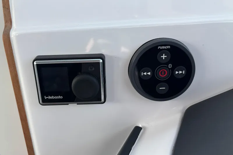Slide: The Image of Control panel of a 2022 Axopar 28 Cabin featuring Webasto and Fusion systems. - 29
