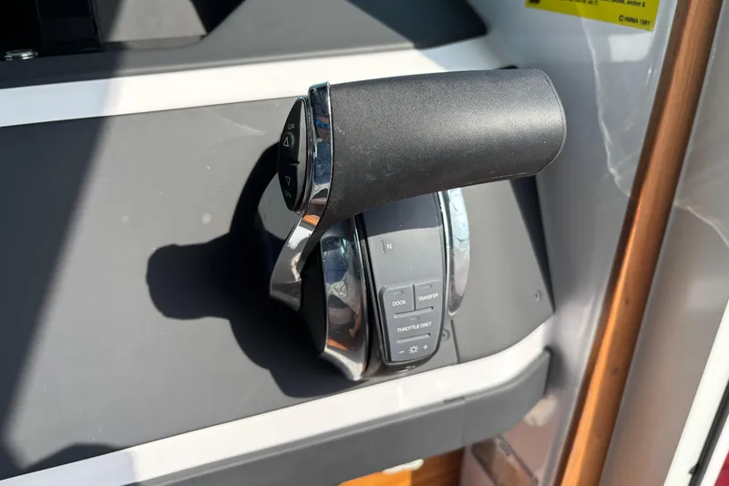 Slide: The Image of Throttle control of 2022 Axopar 28 Cabin boat, featuring ergonomic design and intuitive buttons. - 30