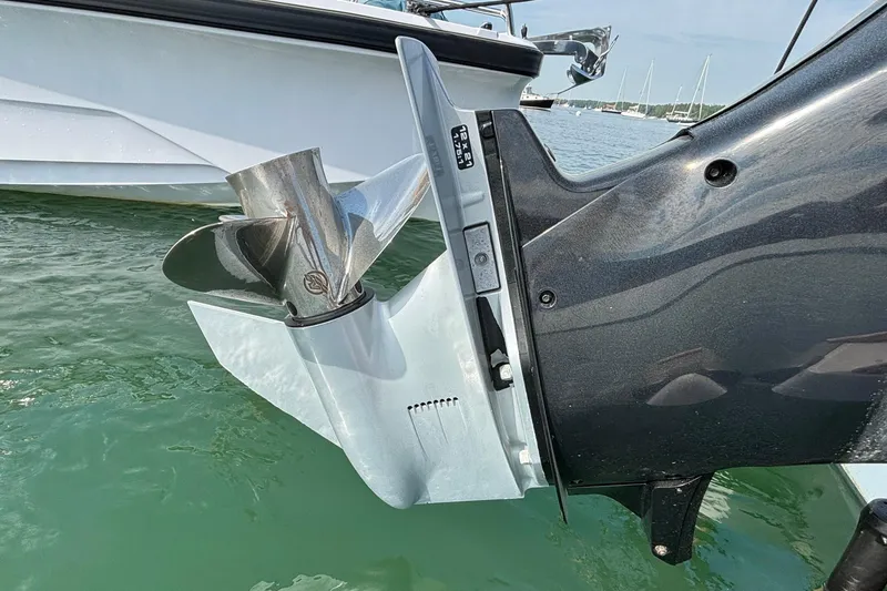 Slide: The Image of Close-up of a 2022 Axopar 28 Cabin boat's propeller in water. - 41