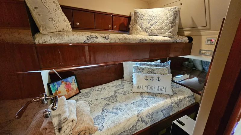 Slide: The Image of Cozy cabin interior of 2005 Neptunus 56 Flybridge with nautical-themed bedding. - 28