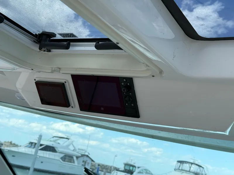 Slide: The Image of View from inside a Tiara Yachts 38 LS, looking out at other boats in the harbor. - 22