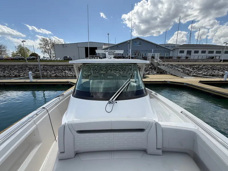 Slide: The Image of Tiara Yachts 38 LS 2024 at the dock with a cloudy sky. - 27