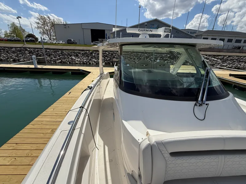 Slide: The Image of 2024 Tiara Yachts 38 LS at dock with sleek design and spacious cockpit. - 28