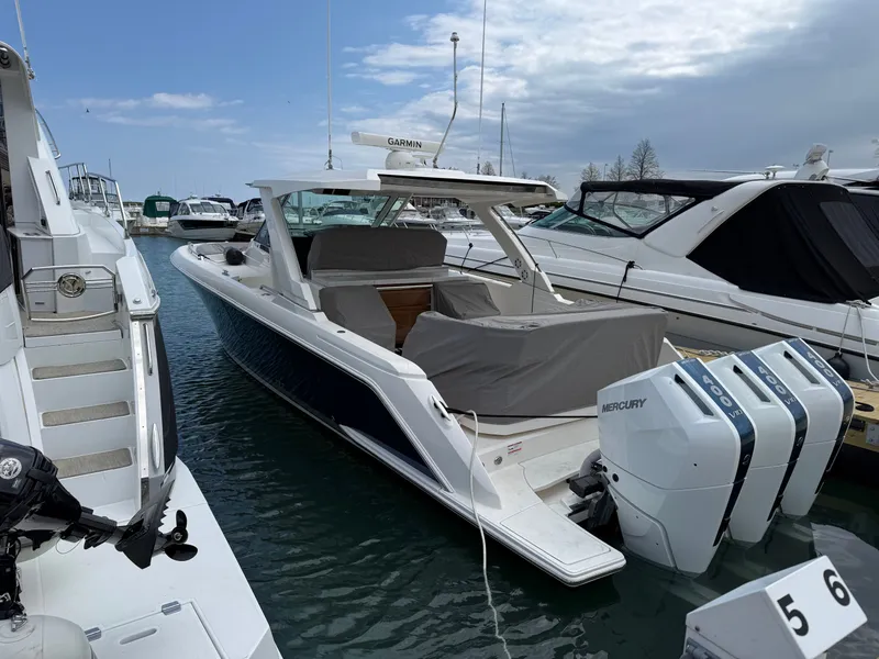 Slide: The Image of 2024 Tiara Yachts 38 LS on the water, featuring three Mercury outboard engines. - 3