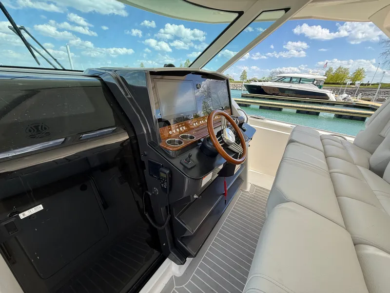 Slide: The Image of Tiara Yachts 38 LS 2024: Luxurious cockpit with modern helm and comfortable seating. - 34