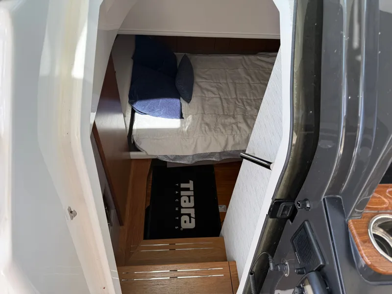 Slide: The Image of Interior of the 2024 Tiara Yachts 38 LS with a bed and wooden flooring. - 36