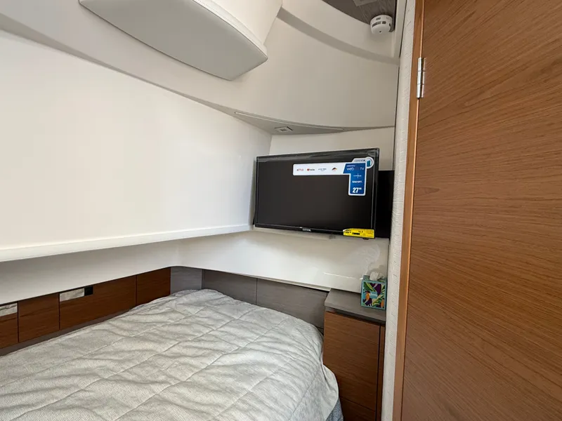 Slide: The Image of Interior of a 2024 Tiara Yachts 38 LS with bed and TV. - 38