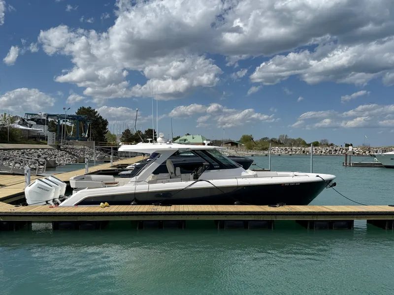 Slide: The Image of 2024 Tiara Yachts 38 LS docked on a sunny day. - 4
